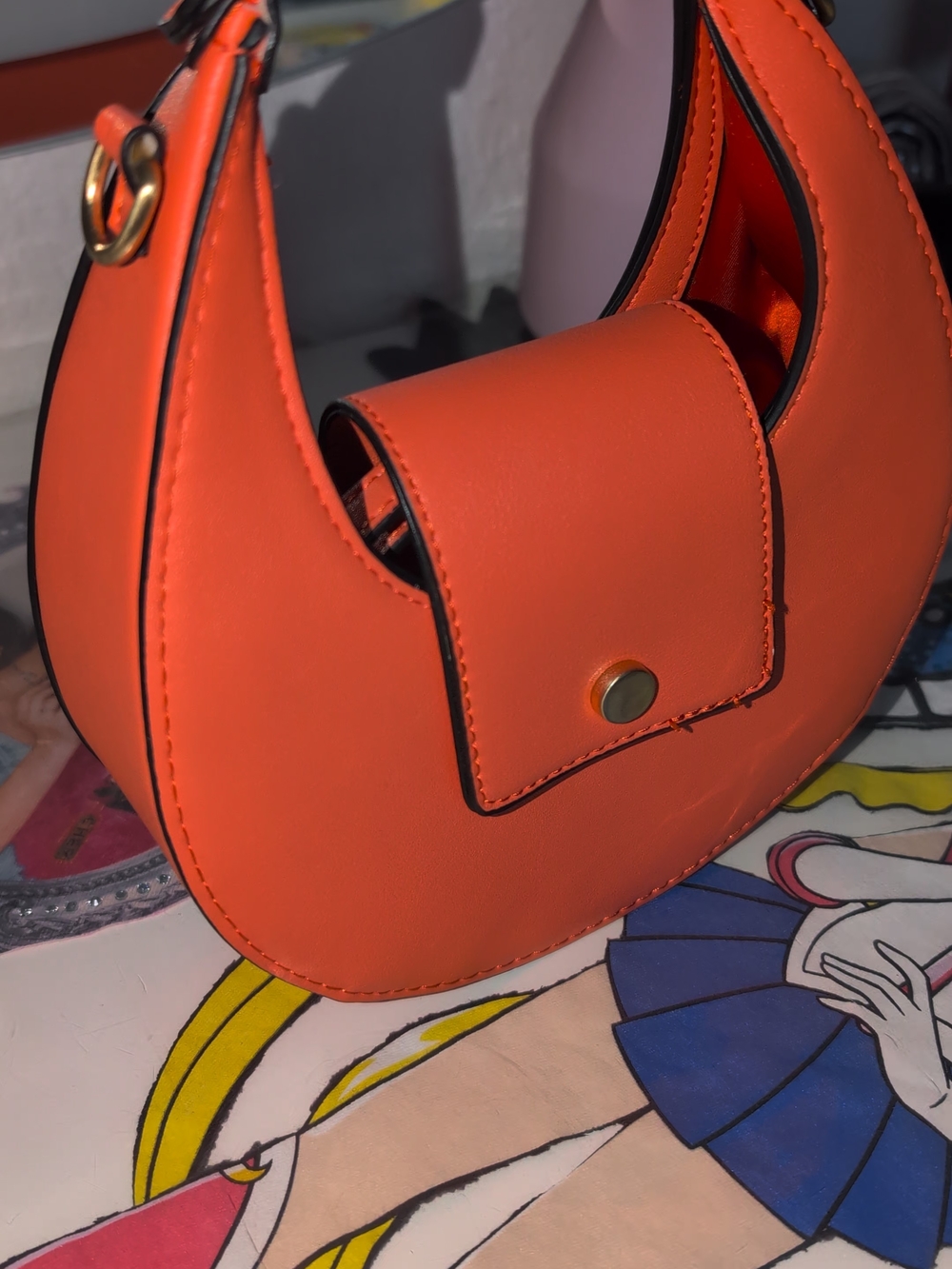 Compact Orange Crescent Mini Bag with Front Snap Pocket